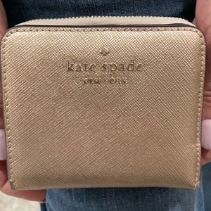 Kate Spade metallic rose gold Spencer small zip around wallet